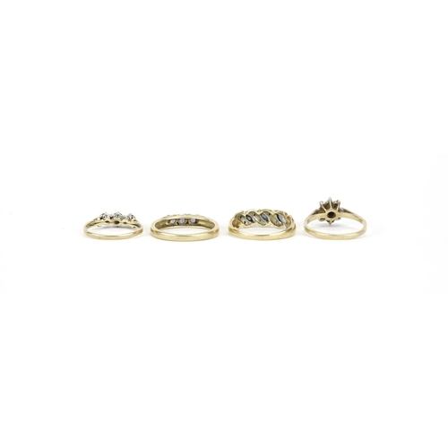 2722 - Four 9ct gold rings set with assorted stones including diamonds and sapphires, various sizes, 7.2g