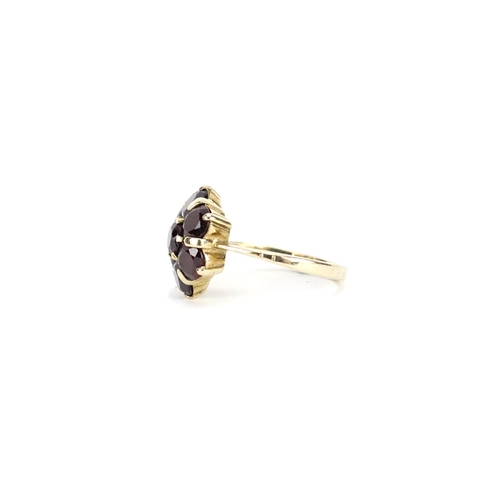 2900 - 9ct gold garnet flower head ring, size L, 4.0g