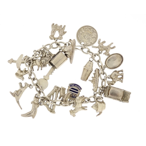 2849 - Silver charm bracelet with a selection of mostly silver charms including harp, cocktail shaker, kang... 