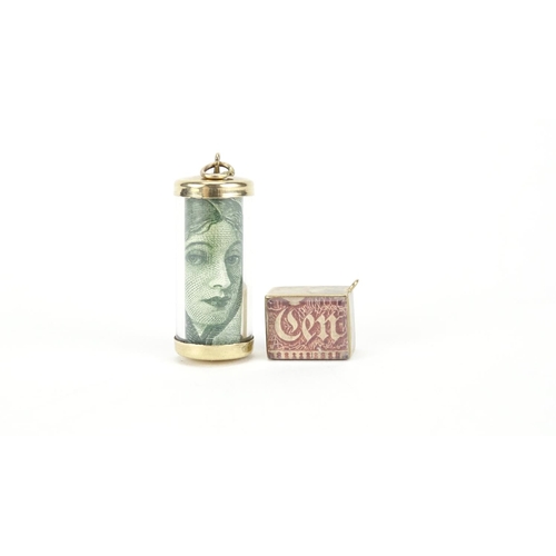 2799 - Two 9ct gold emergency note charms, the largest 3cm high, 7.5g