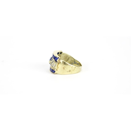 2718 - Gold coloured ring set with blue and clear stones, indistinct marks, size J, 4.2g