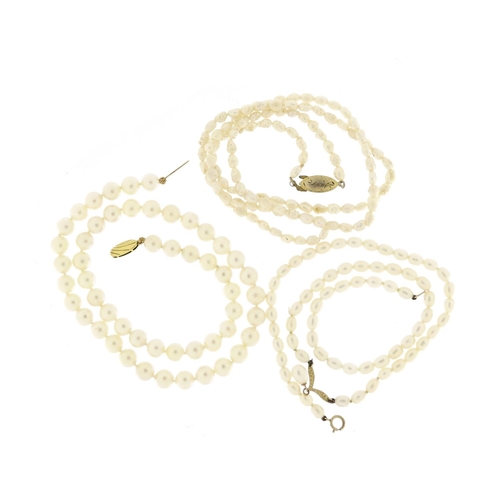 2925 - Three pearl necklaces, two with 9ct gold clasps, 53.6g