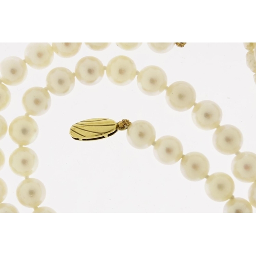 2925 - Three pearl necklaces, two with 9ct gold clasps, 53.6g