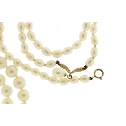 2925 - Three pearl necklaces, two with 9ct gold clasps, 53.6g