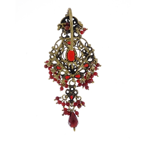 2949 - Indian gilt metal red and clear glass head piece, 9cm in length