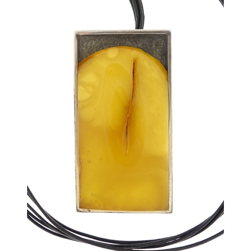 2948 - Designer sterling silver and butterscotch amber necklace by Mariusz Gliwinski, the pendant 6.5cm in ... 