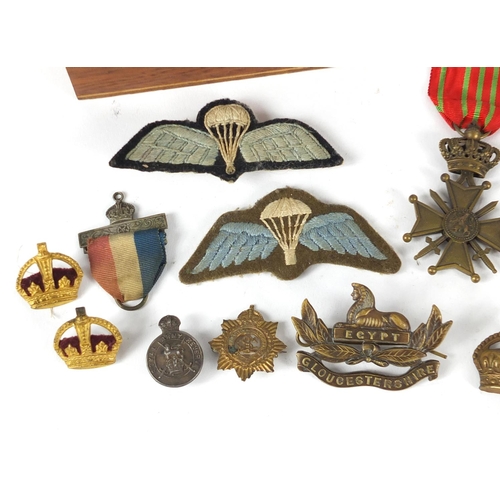 525 - Militaria including medal, cloth patches, pips and Metropolitan police whistle