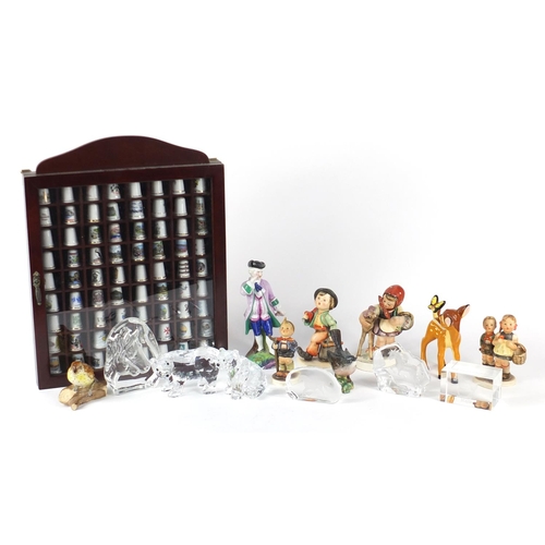 254 - China and glassware including thimbles in a display case, animal paperweights and Goebel figures