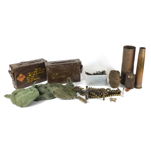 537 - Militaria including ammunition belts, canvas sacks and ammunition tins