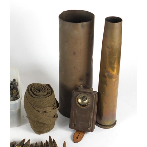 537 - Militaria including ammunition belts, canvas sacks and ammunition tins