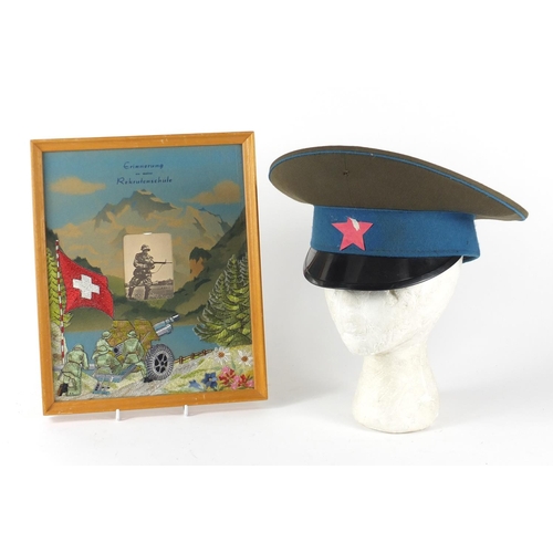 536 - Military interest visor cap and a silk work tapestry photo frame