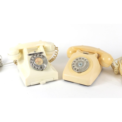 147 - Two vintage cream Bakelite dial telephones