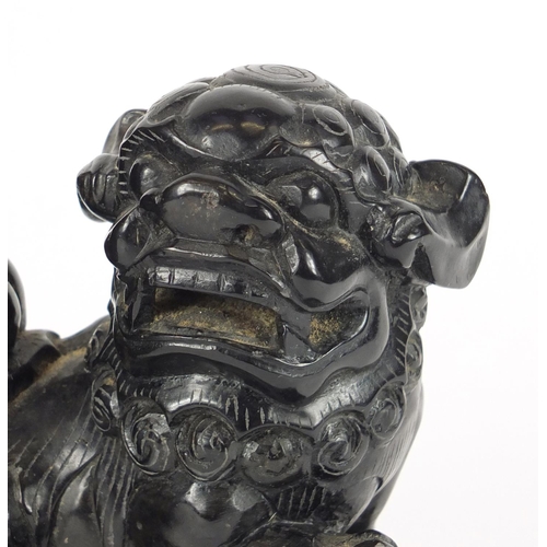 252 - Pair of Chinese ebony carved stone dog-of-foo bookends, 16.5cm high