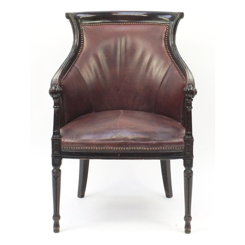 2041 - Mahogany and brown leather library chair on tapering legs, 91cm high