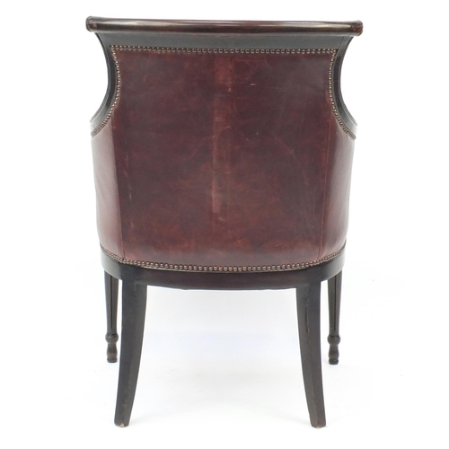 2041 - Mahogany and brown leather library chair on tapering legs, 91cm high