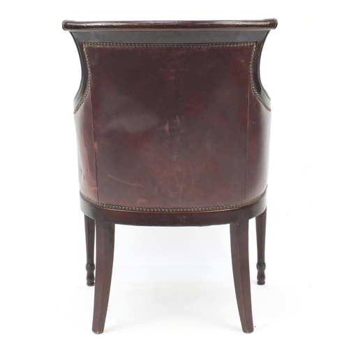 2077 - Mahogany and brown leather library chair on tapering legs, 91cm high