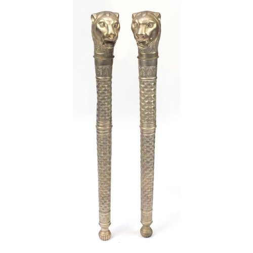 2153 - Pair of silvered metal lion head torch design columns, each 104cm in length