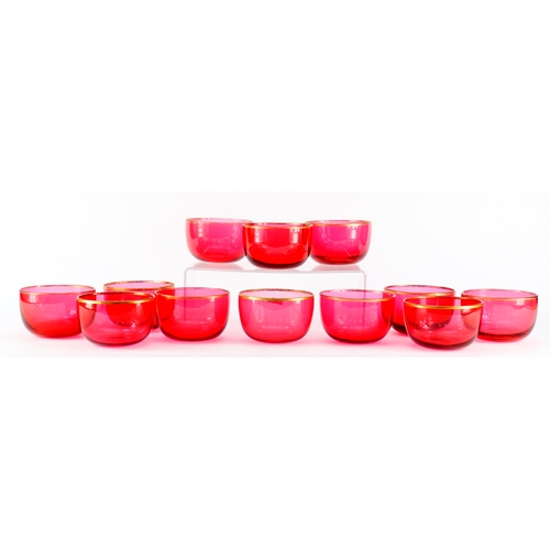 2359 - Set of twelve Victorian cranberry glass finger bowls with gilt rims, 12cm in diameter