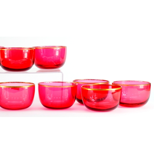 2359 - Set of twelve Victorian cranberry glass finger bowls with gilt rims, 12cm in diameter