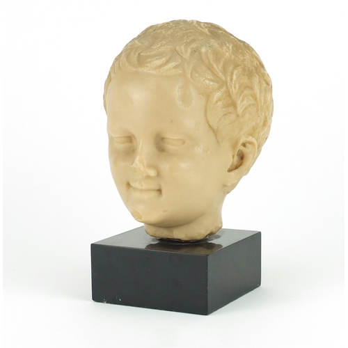 2170 - Wax style bust of a young boy, raised on a square black slate base, 22cm high