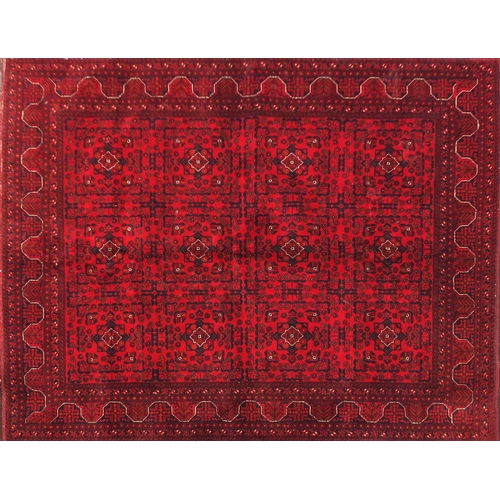 2033 - Rectangular Afghan red ground carpet, 202cm x 152cm
