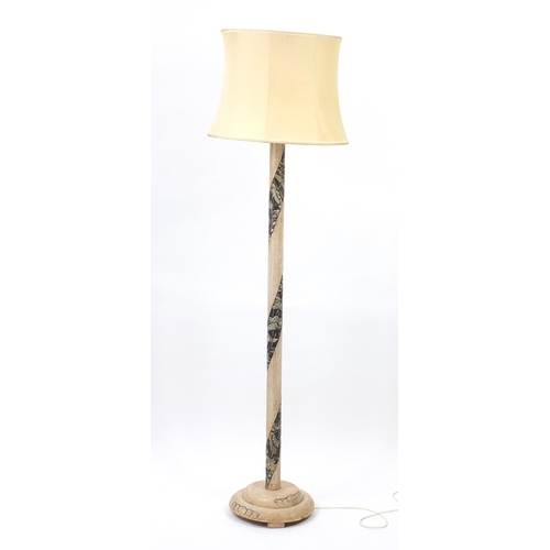 2060 - Chinese limed wood standard lamp carved with flowers, having a silk lined shade, overall 187cm high