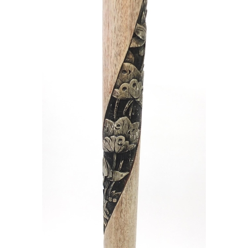 2060 - Chinese limed wood standard lamp carved with flowers, having a silk lined shade, overall 187cm high
