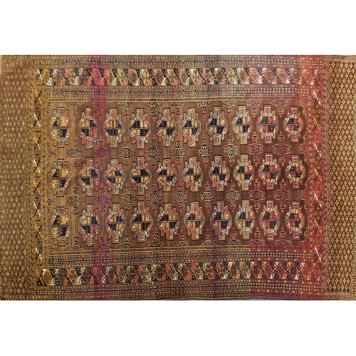 2063 - Rectangular Turkmen red ground rug, 230cm x 154cm