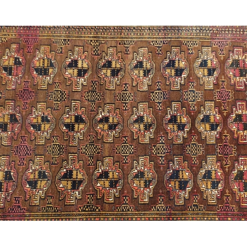 2063 - Rectangular Turkmen red ground rug, 230cm x 154cm