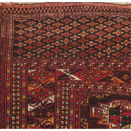 2063 - Rectangular Turkmen red ground rug, 230cm x 154cm