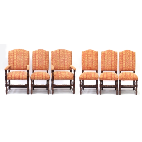 2020 - Set of six oak framed dining chairs with bobbin turned legs, having red and gold geometric upholster... 