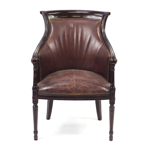 2078 - Mahogany and brown leather library chair on tapering legs, 91cm high