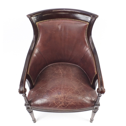 2078 - Mahogany and brown leather library chair on tapering legs, 91cm high