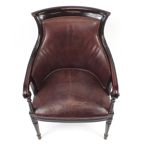 2040 - Mahogany and brown leather library chair on tapering legs, 91cm high