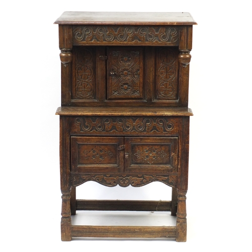 2038 - Ipswich oak side cabinet carved with foliate motifs, 121cm H x 72cm W x 44cm D