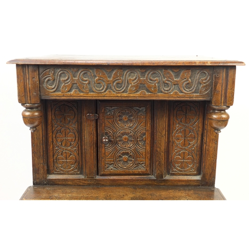 2038 - Ipswich oak side cabinet carved with foliate motifs, 121cm H x 72cm W x 44cm D