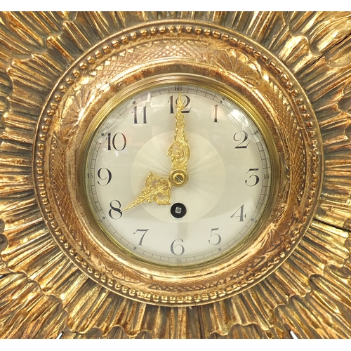 2057 - Vintage gilt wood sunburst design wall clock, with silvered dial and Arabic numerals, impressed '26'... 