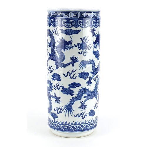 2105 - Chinese blue and white porcelain stick stand, hand painted with dragons chasing a flaming pearl amon... 