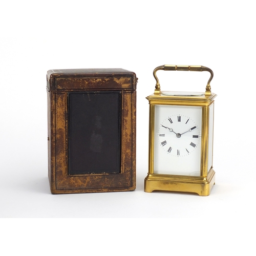 2164 - Large gilt brass cased carriage clock striking on a gong, with enamelled dial having Roman numerals ... 