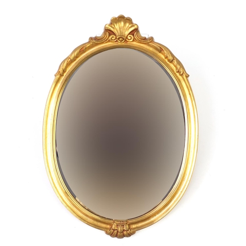 47 - Oval gilt framed wall hanging mirror, 60cm x 42cm