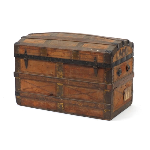 7 - Vintage dome topped leather and wooden bound travelling trunk, with His Majesty's Service labels, 54... 
