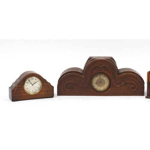 63 - Three mantel clocks including one carved oak and one with eight day movement, the largest 47cm in le... 