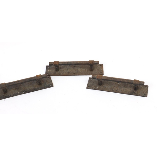 180 - Set of four vintage cast iron door handles and a pair of brass door handles, 30cm in length