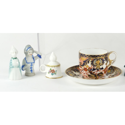 161 - China including a Derby cup and saucer, half pin dolls and candle snuffers