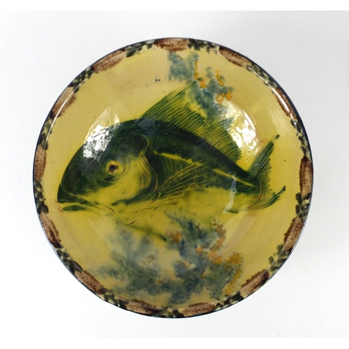 68 - Studio pottery bowl decorated with a fish, signed to the base, 26cm in diameter