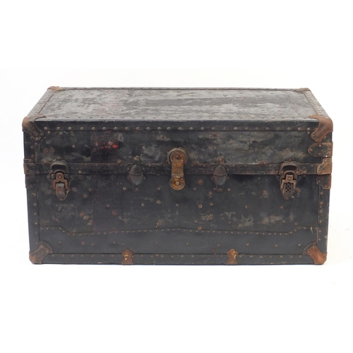 14 - Large vintage metal and leather bound steamer trunk, fitted with four suitcases, two drawers and war... 