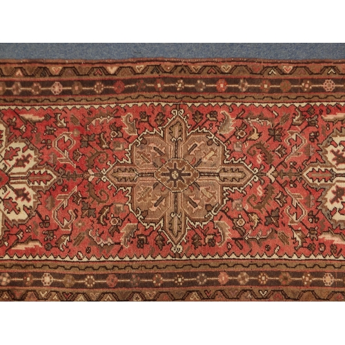 5 - Rectangular carpet runner having an all over stylised floral design, 298cm x 88cm