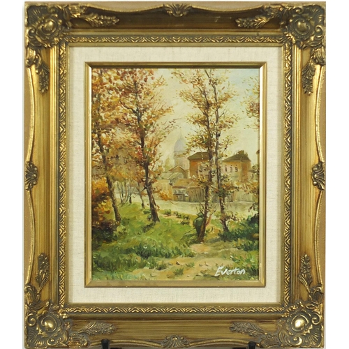 218 - Figure in tree's before a town, oil on canvas, mounted and framed 24cm x 19cm
