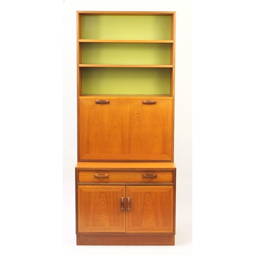 34 - Vintage teak G-Plan side cabinet fitted with open shelves above a fall, with fitted interior, a draw... 