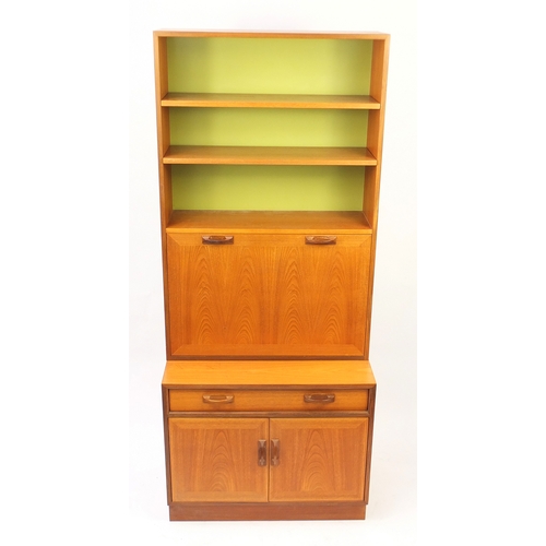 34 - Vintage teak G-Plan side cabinet fitted with open shelves above a fall, with fitted interior, a draw... 